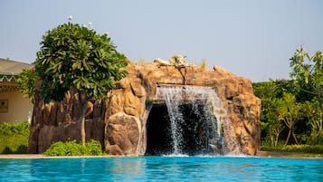 Outdoor pool, open 7:00 AM to 7:00 PM, pool umbrellas, pool loungers