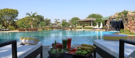 Outdoor pool, open 7:00 AM to 7:00 PM, pool umbrellas, pool loungers