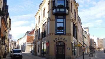 A corner building with a sign reading "BÜCHER".