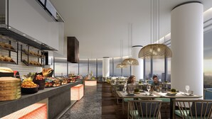 A modern restaurant with a long counter displaying various dishes, high ceilings, and a city view. - DoubleTree by Hilton Foshan Nanhai (Foshan)