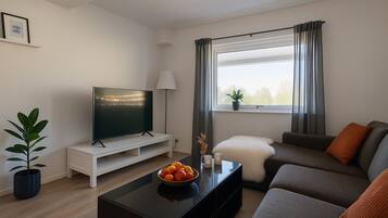 Standard Apartment | Living area | TV, Netflix, first-run films, streaming services