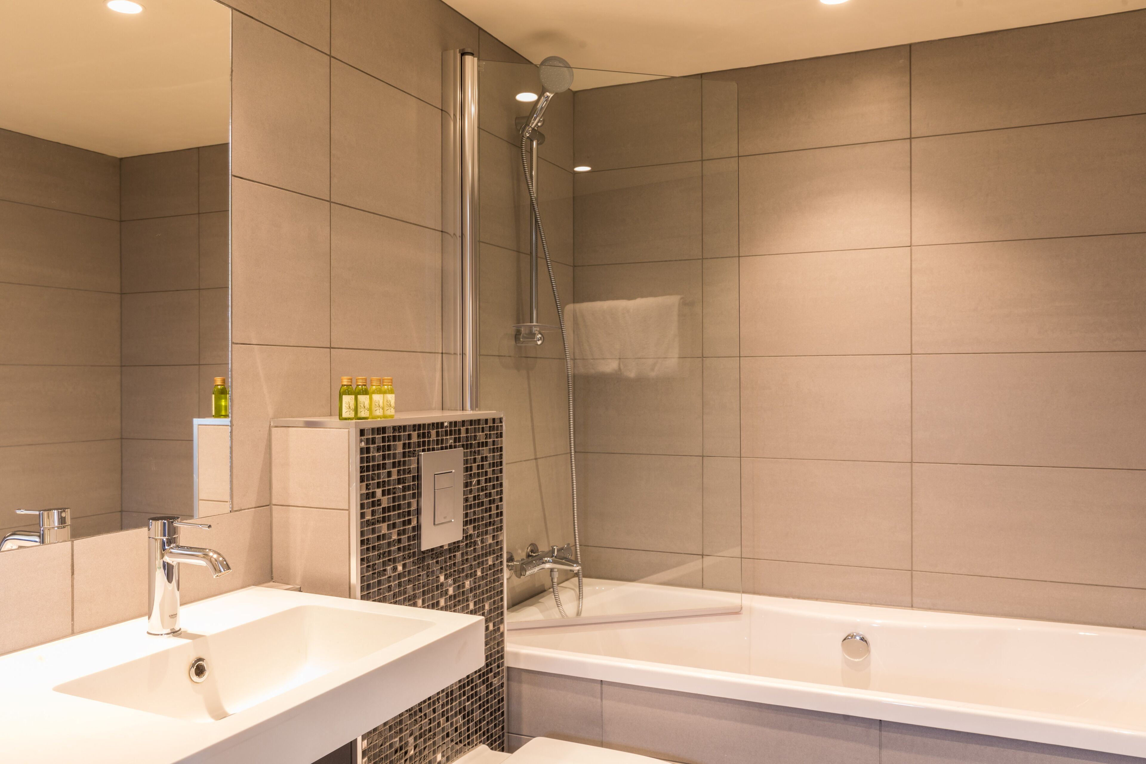 standard double room | bathroom | shower, hair dryer, towels, soap