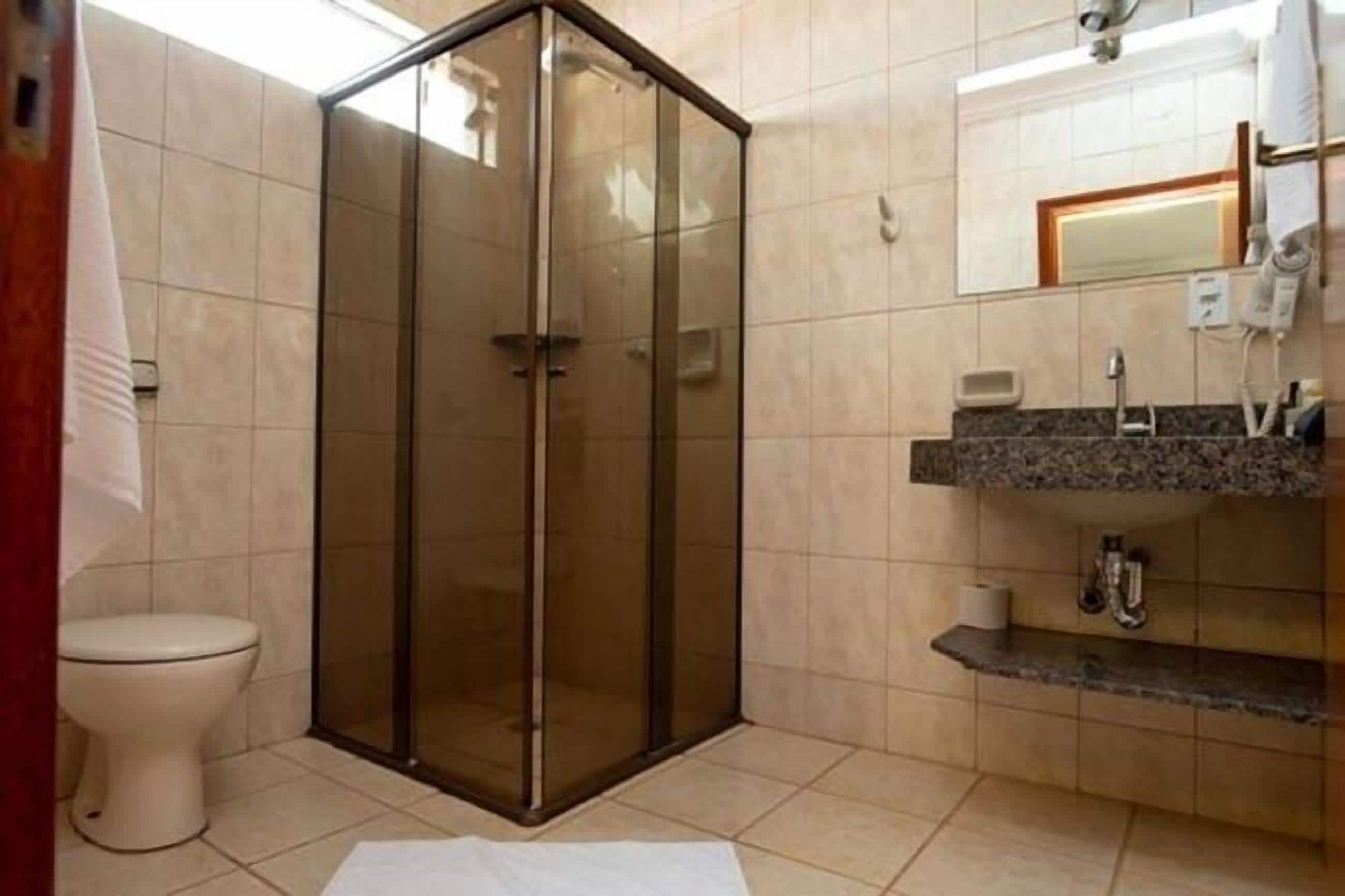 superior double room | bathroom | shower, hair dryer, towels