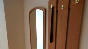 A wooden wardrobe with a mirror and two doors. - VIP Apartments in the Centre (Mukachevo)