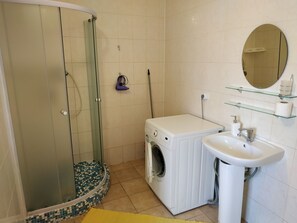 Apartment, 2 Bedrooms | Bathroom | Shower, hair dryer, towels, soap