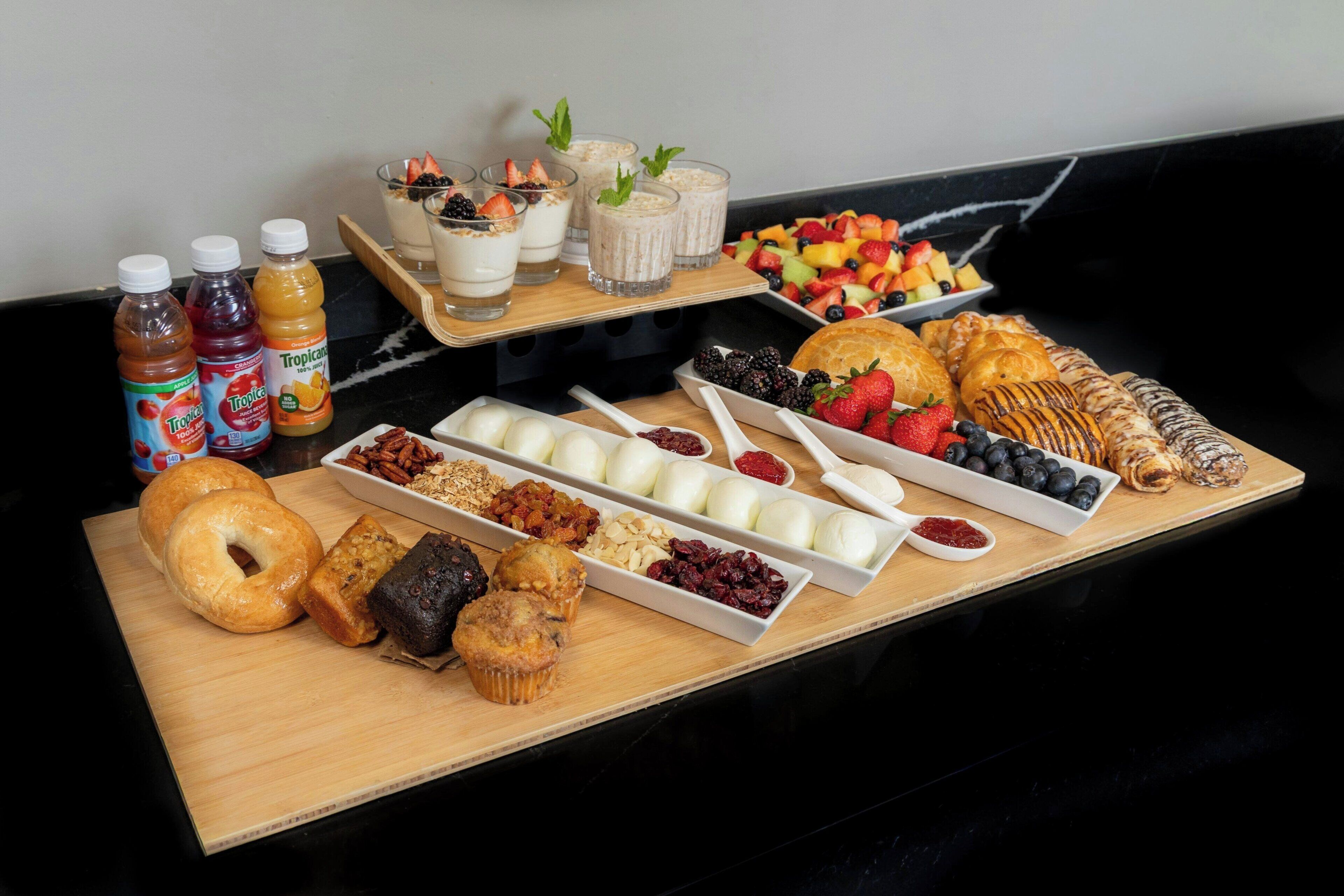 A breakfast buffet with various food items and beverages.
