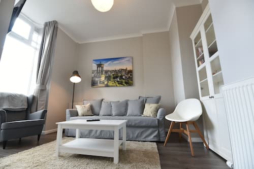 Luxury Apartment | Living area | 50-inch flat-screen TV with cable channels, Smart TV, tablet