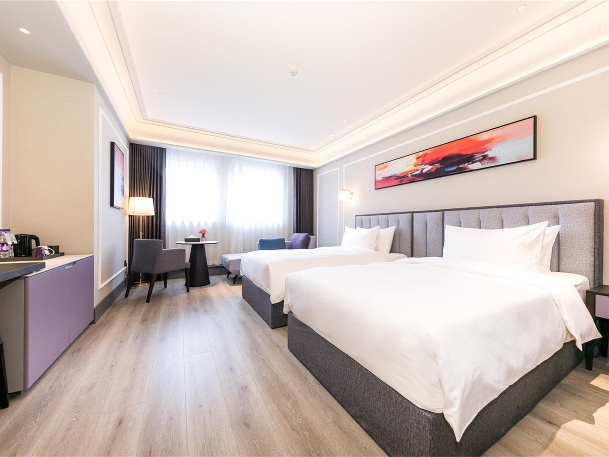 Deluxe Room, 2 Twin Beds | Free minibar, in-room safe, desk, laptop workspace
