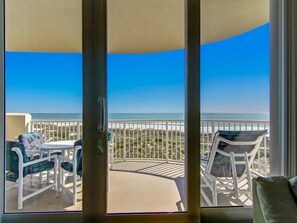 A balcony with a view of the beach and ocean. - 19-ocean-place (Fernandina Beach)