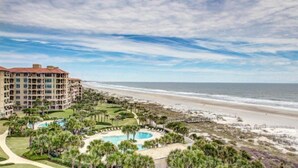A beachfront hotel with a pool, beach access, and ocean views.