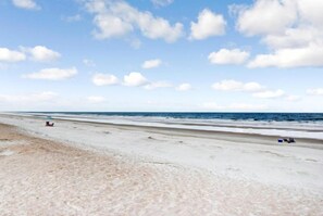 A beach with a clear sky and a few clouds. - B117-amelia-surf-and-racquet (Fernandina Beach)