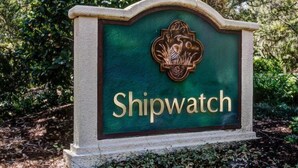 A sign with the name 'Shipwatch' and a decorative emblem. - 1340-shipwatch (Fernandina Beach)