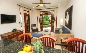 Condo (Charming Garden View Apt in Exclusive) | Living room | Flat-screen TV - Charming Garden View Apt in Exclusive Community (Jacó)
