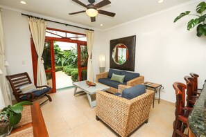Condo (Charming Garden View Apt in Exclusive) | Living room | Flat-screen TV
