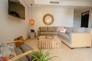 Condo (3BR/2.5BA Designer Condo in Beachfron) | Living room | Flat-screen TV - 3br/2.5ba Designer Condo in Beachfront Community (Jacó)