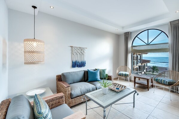 Condo (Incredible Beach Views in Fantastic C) | Living room | Flat-screen TV
