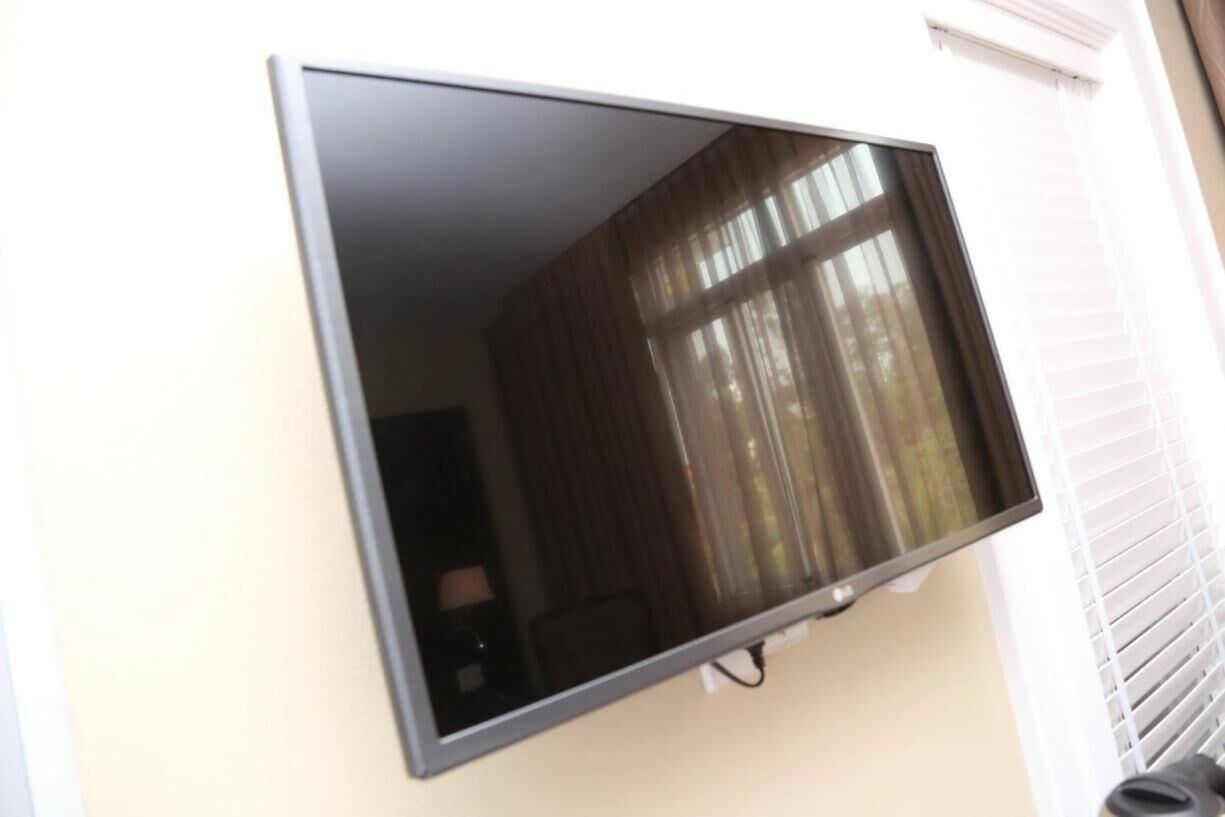 A flat-screen TV mounted on a wall.