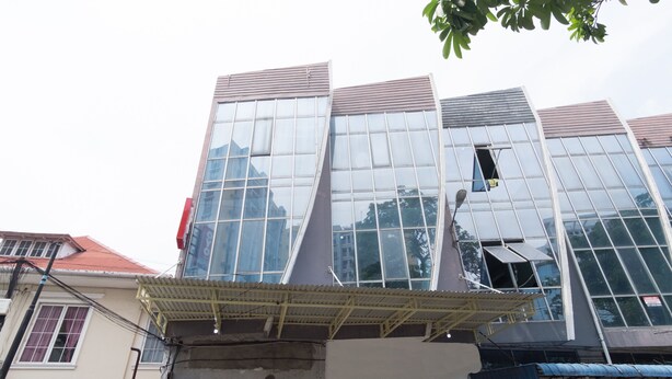 A modern building with large windows and a unique architectural design.