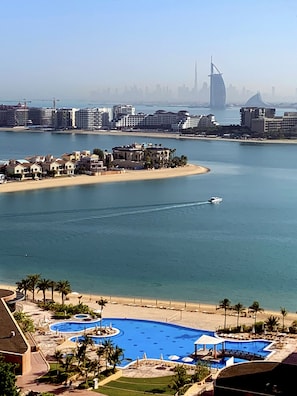 Enjoy water activities at our marina, relax by the large, curved pool, and unwind on the sandy beach.
