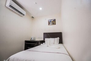 Superior Single Room, No Windows | Down comforters, memory foam beds, individually decorated, desk