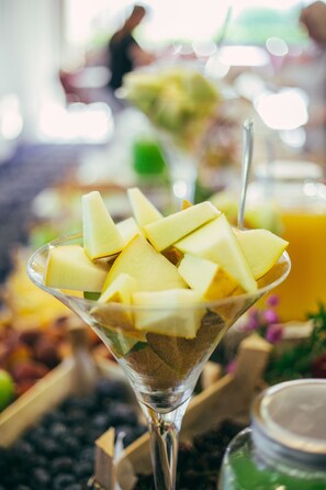A martini glass filled with diced apples and a straw. - Hotel Epinal - Bitola (Bitola)