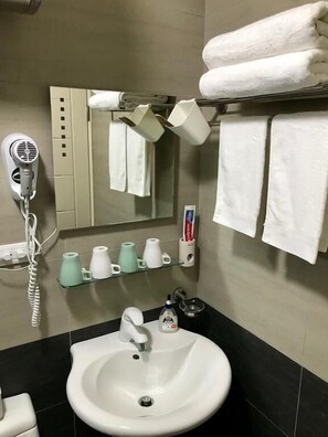 Shower, free toiletries, hair dryer, slippers