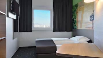 Habitación individual | Escritorio, insonorización, wifi gratis y ropa de cama