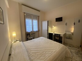 Double Room | Minibar, in-room safe, desk, cribs/infant beds