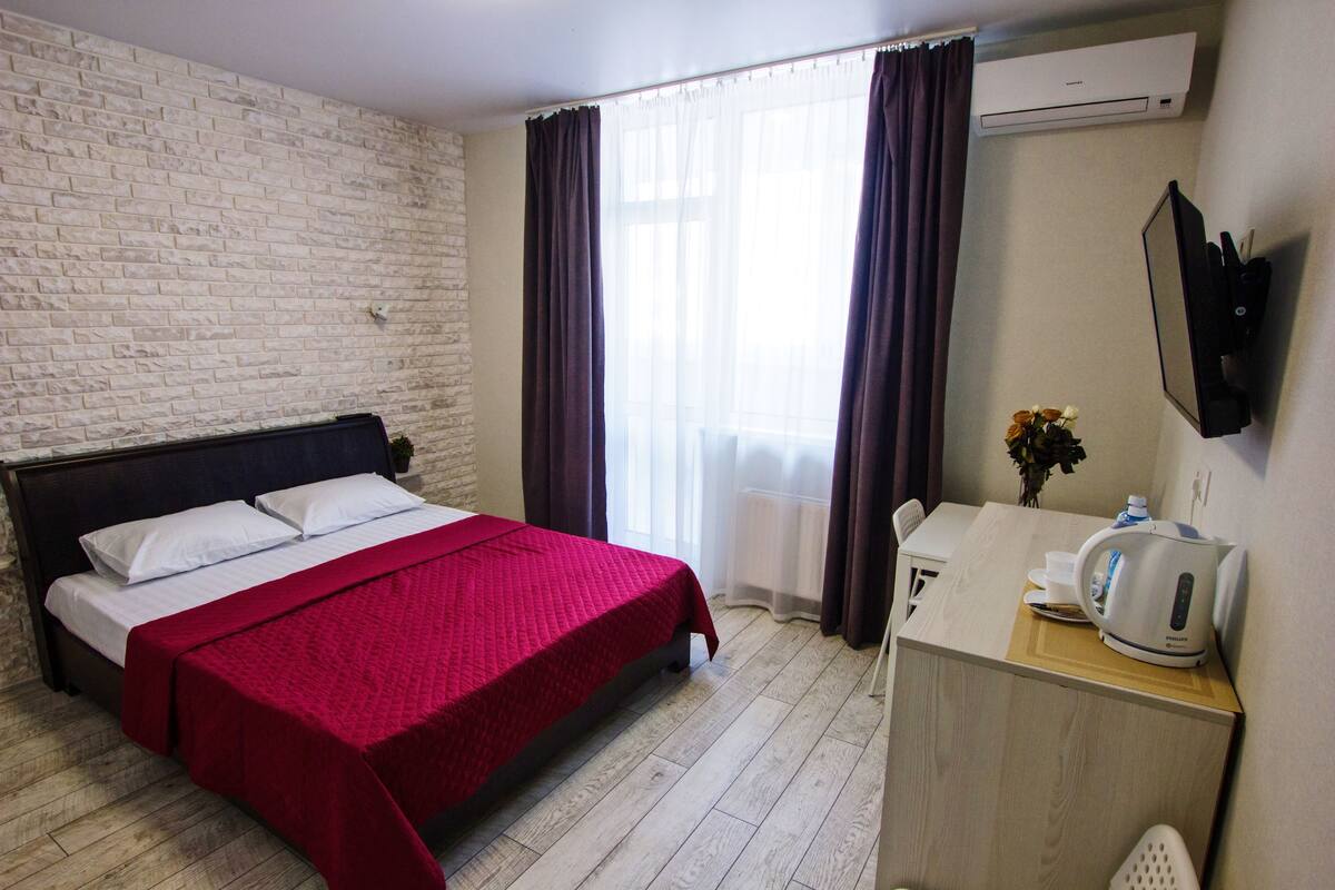 Habitación Deluxe, balcón (Loft) | Ropa de cama de alta calidad, edredón y camas con efecto memoria