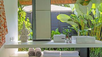 Separate tub and shower, rainfall showerhead, free toiletries