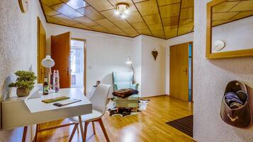 Deluxe Apartment, 1 Bedroom | Living area | 43-inch Smart TV with cable channels, TV, heated floors