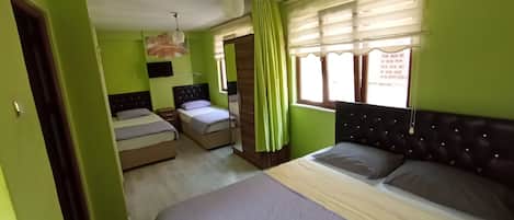 Economy Quadruple Room | Soundproofing, free WiFi, bed sheets
