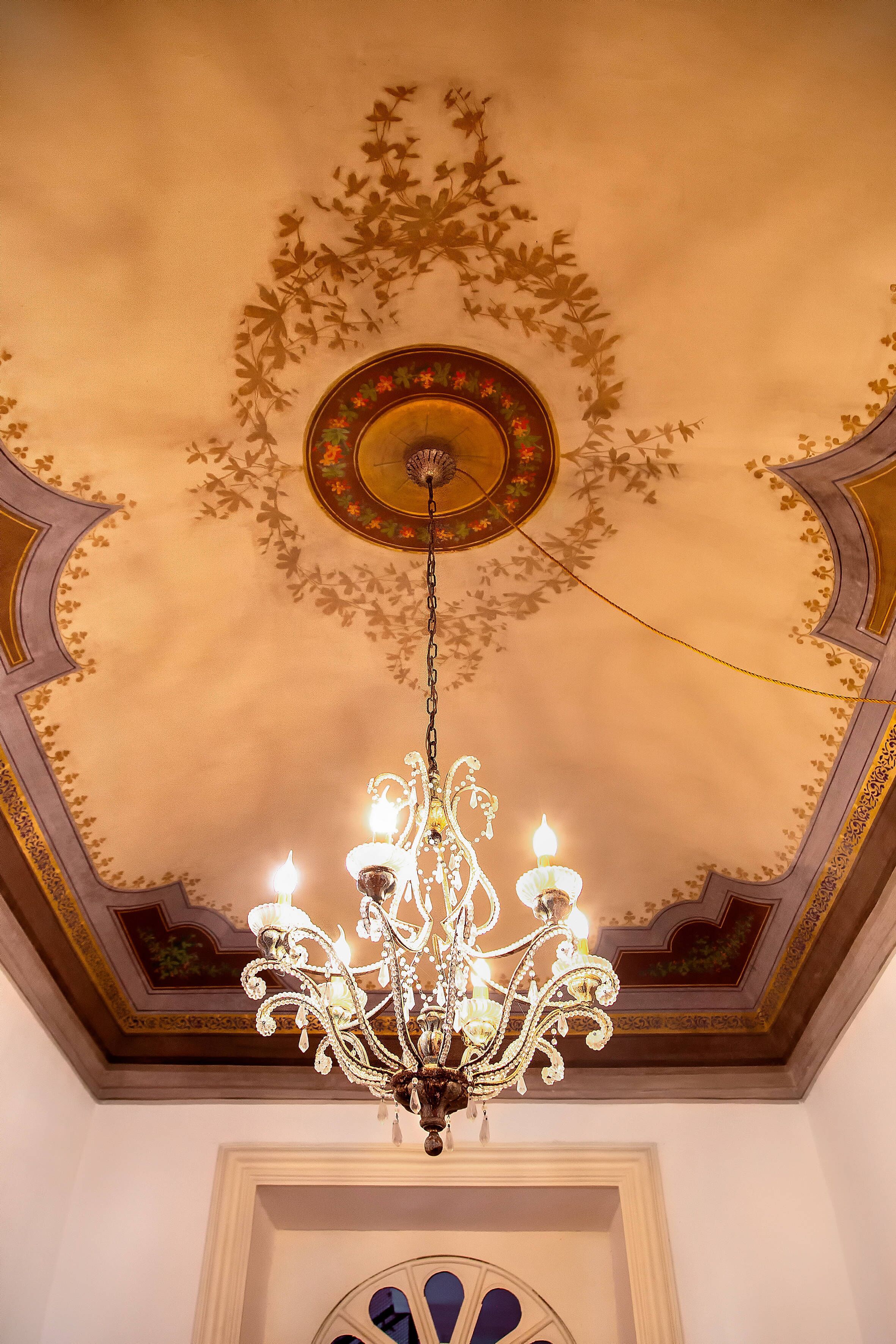 A chandelier with multiple lights hanging from the ceiling.