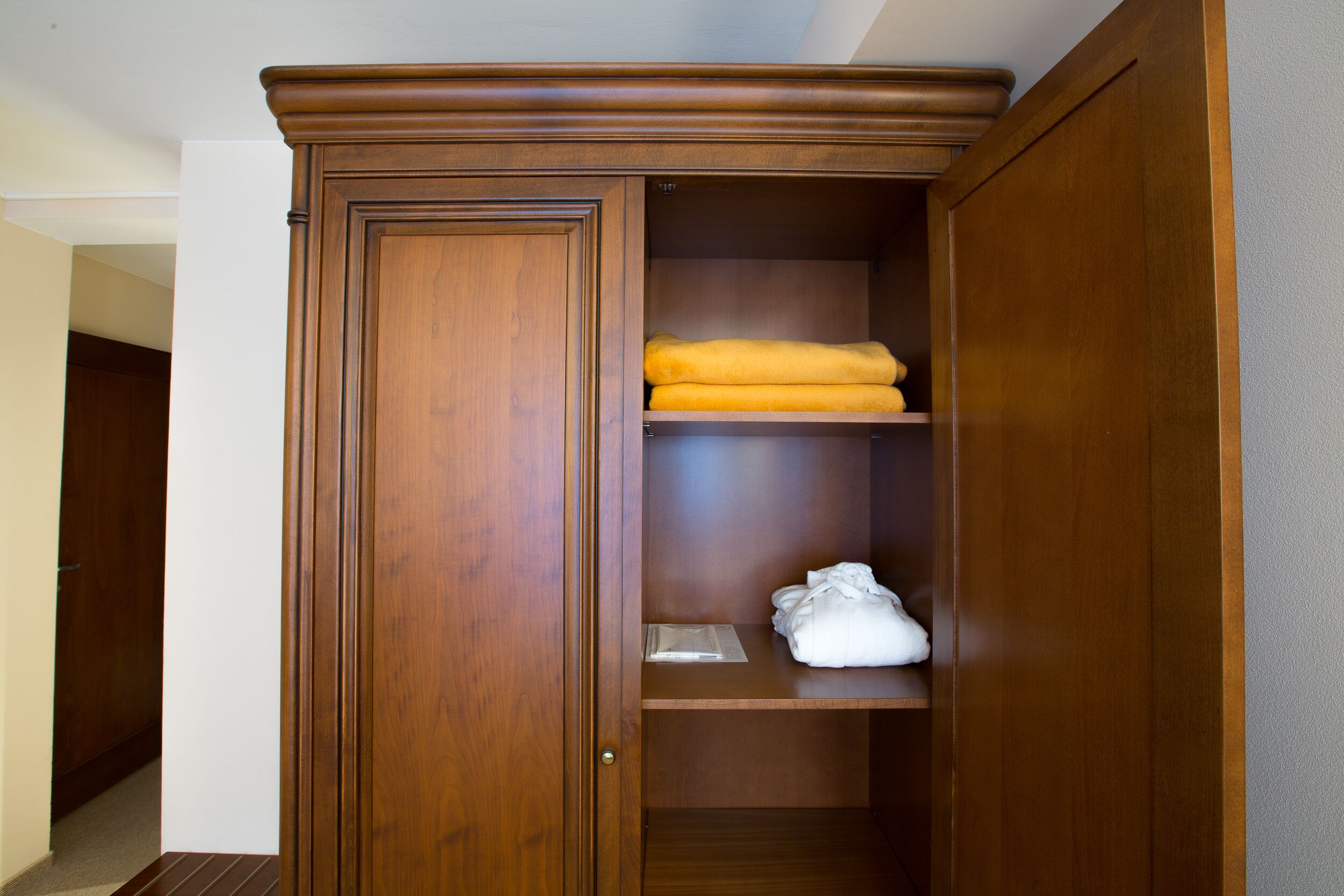 hypo-allergenic bedding, desk, laptop workspace, blackout curtains