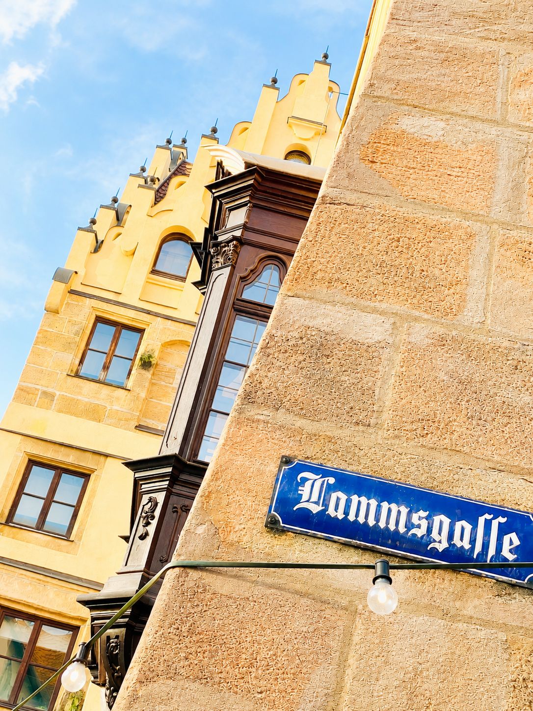 A street sign with 'Dammgasse' indicating a location.