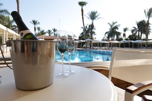 Outdoor pool, pool umbrellas, sun loungers