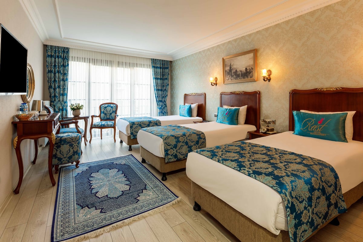 Deluxe Triple Room, Balcony | 1 bedroom, premium bedding, free minibar items, in-room safe