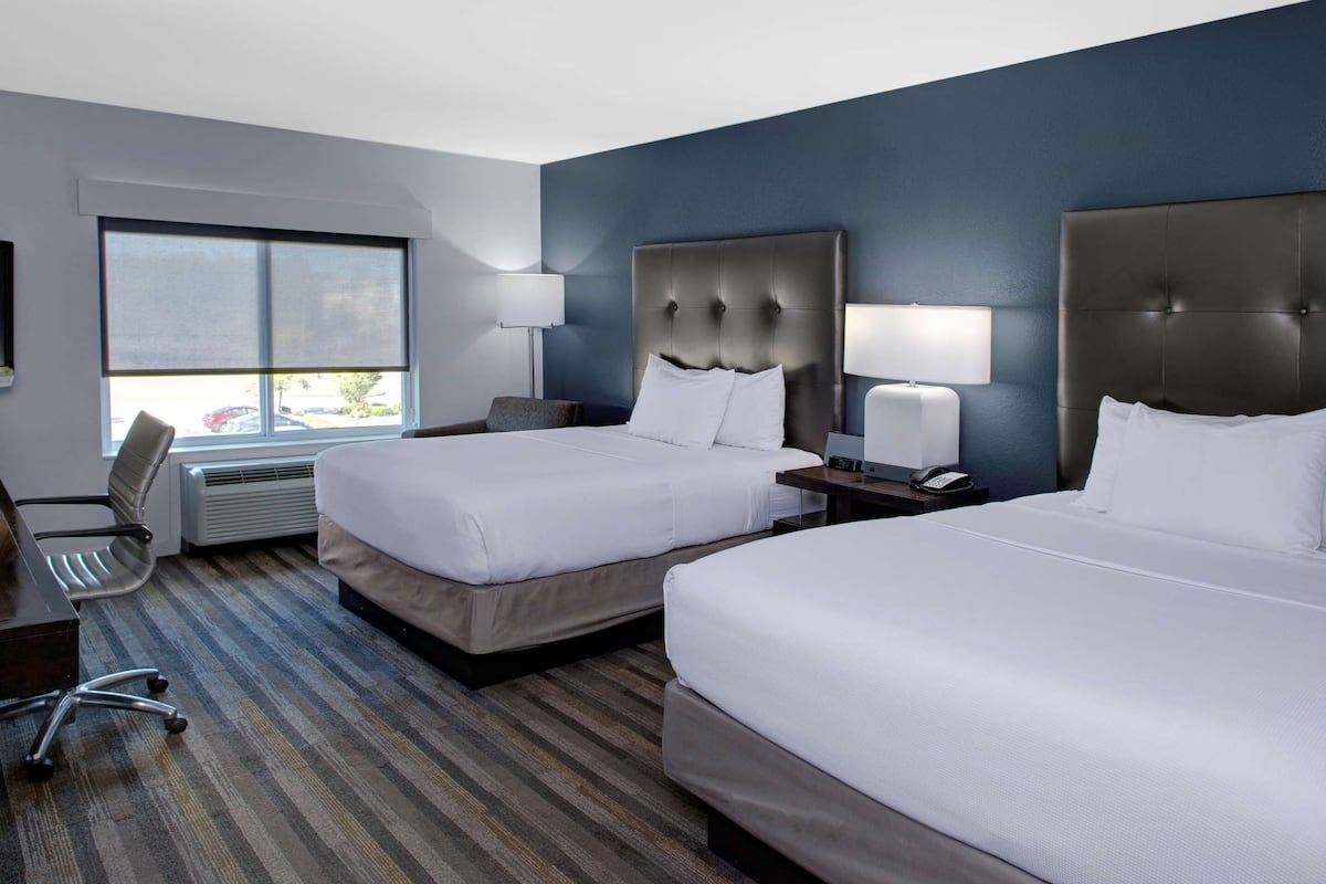 Premium bedding, pillow-top beds, desk, blackout curtains