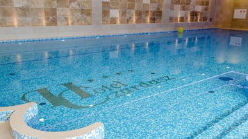 Indoor pool, open 4:00 PM to 9:00 PM, pool loungers