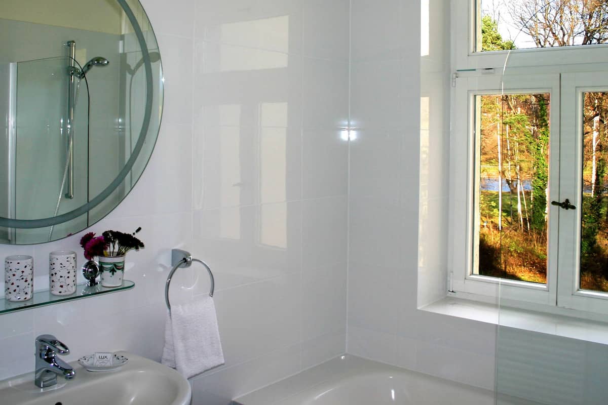 double room, river view | bathroom | free toiletries, hair dryer, towels