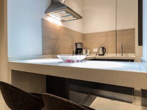 Executive Suite, 1 King Bed, Bathtub, Beachfront | Private kitchen | Coffee/tea maker, electric kettle