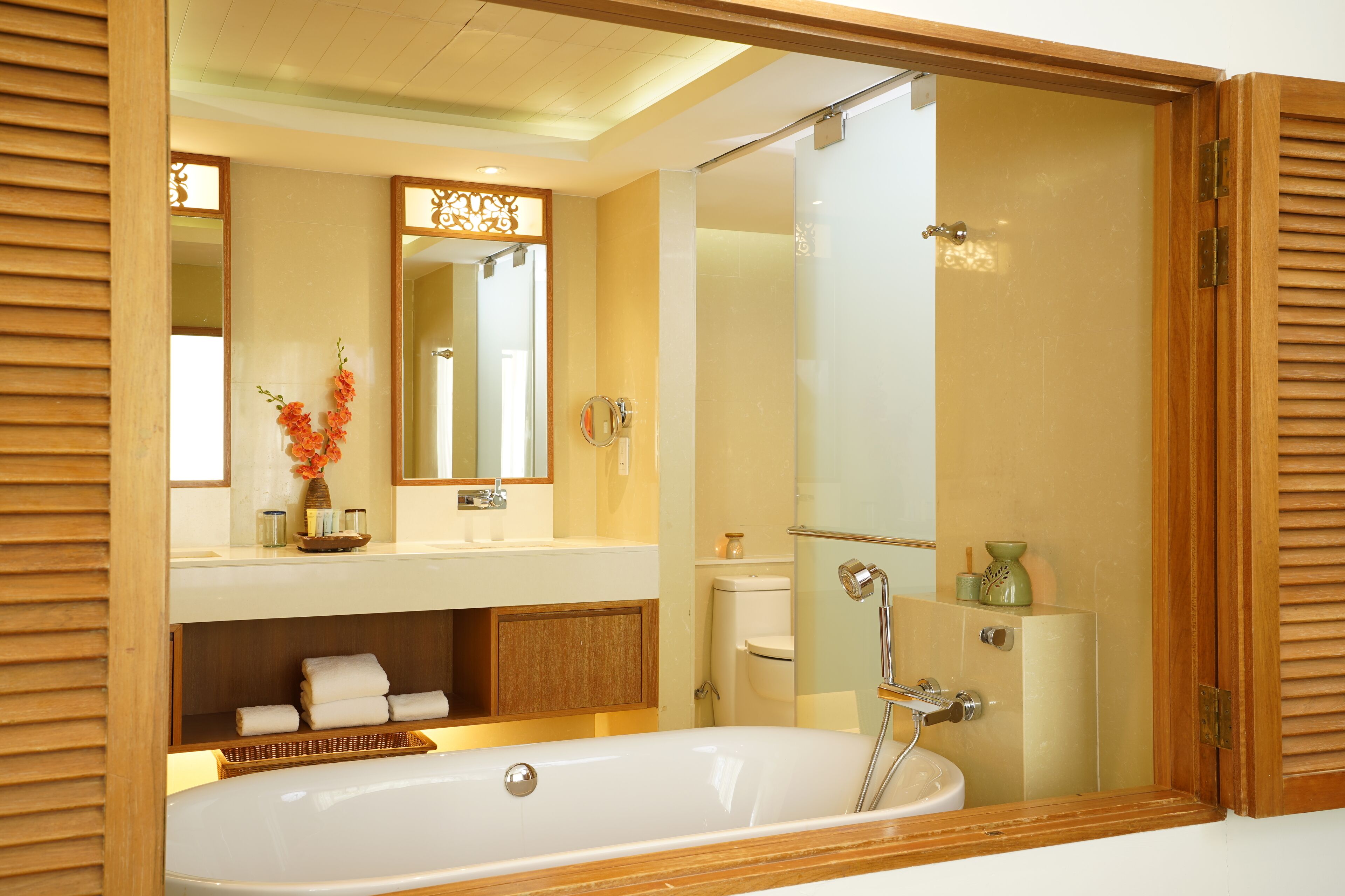 A modern bathroom with a freestanding bathtub, a vanity with a mirror, and a shower enclosure.