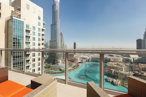A high-rise building with a view of a cityscape and a swimming pool. - Wyndham Downtown Dubai (Dubai)