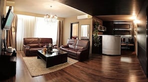 Apartment, Balcony | Minibar, in-room safe, desk, iron/ironing board