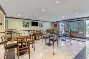 Enjoy meals in this stylish dining area with a flat-screen TV and beautiful views of the outdoors.