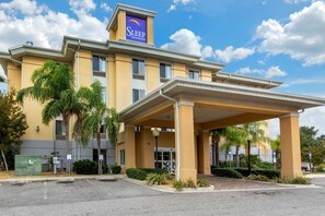 Welcome to Sleep Inn & Suites, featuring a modern architectural design and beautifully landscaped surroundings.