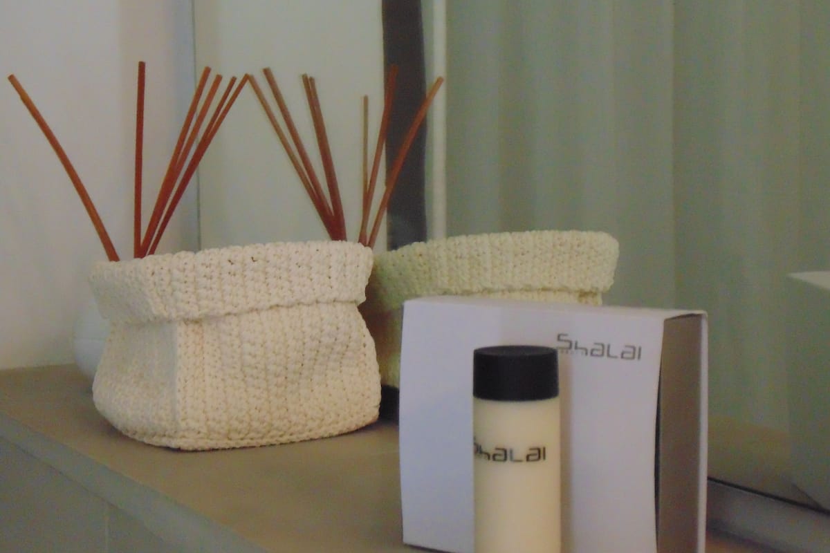 shower, hair dryer, slippers, towels