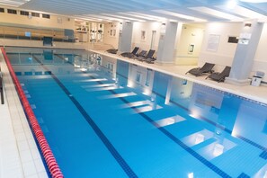 Relax by the pool surrounded by lounge chairs and enjoy a refreshing swim.
