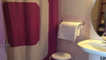 Shower, hair dryer, slippers, towels