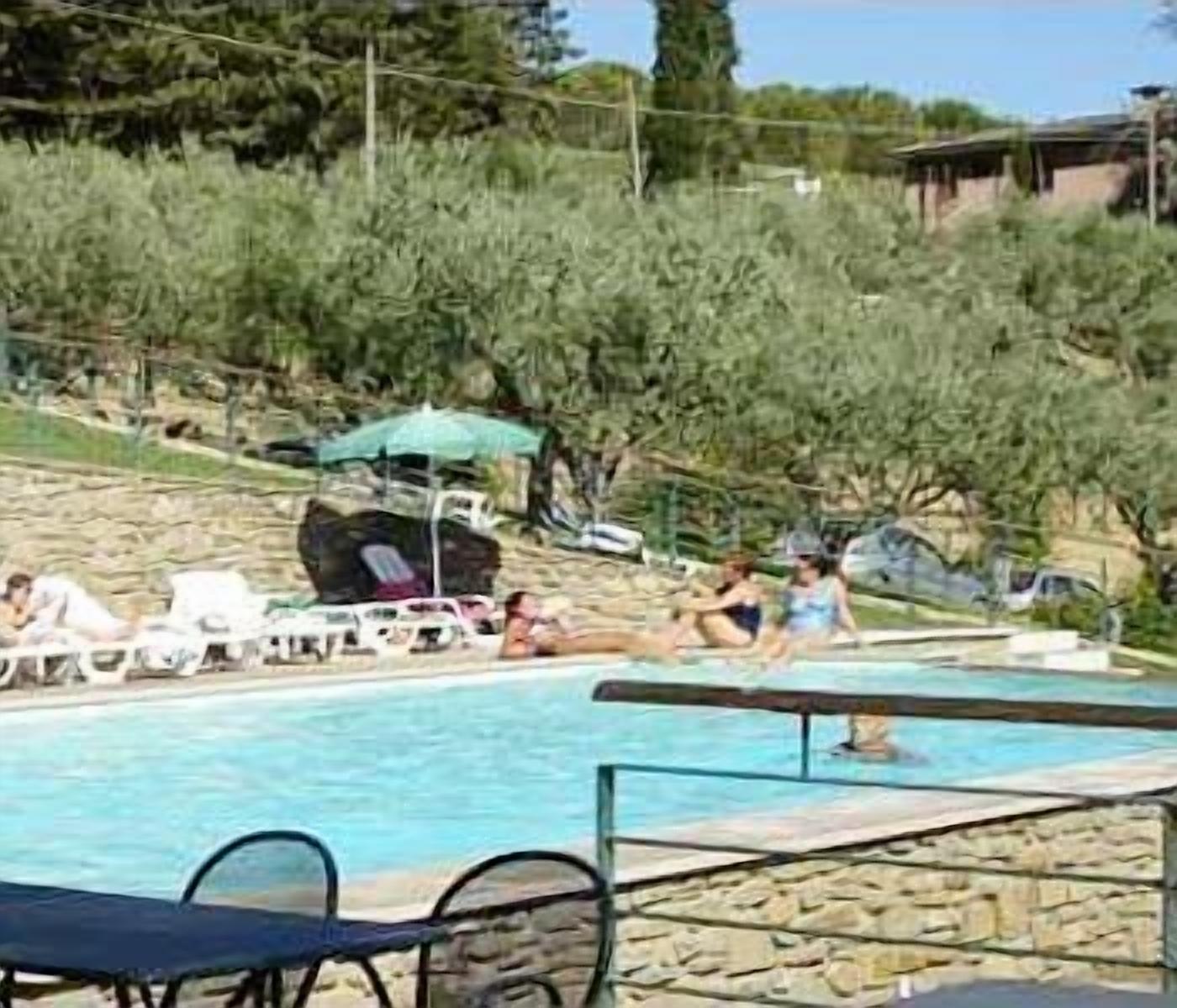 outdoor pool, open 8:30 am to 6:00 pm, pool umbrellas, pool loungers